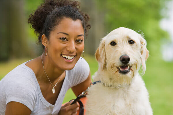 Woman with dog on leash